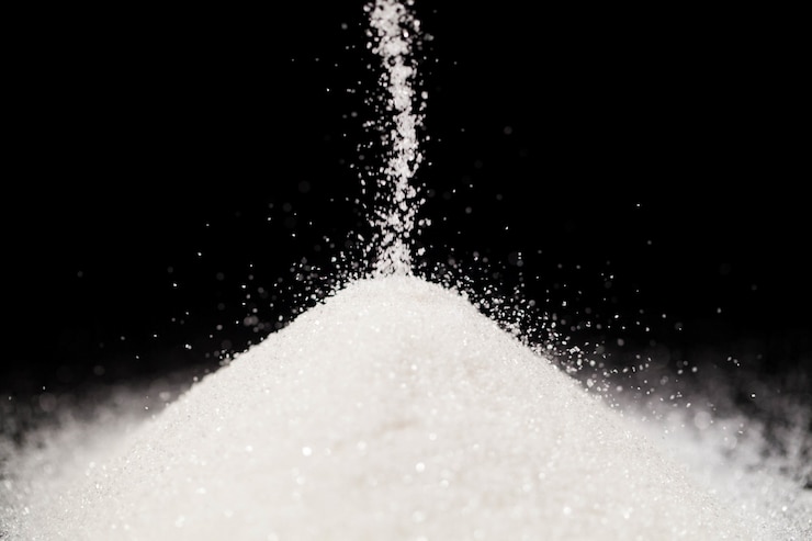 Photo gratuit le sucre repose sur le fond noir