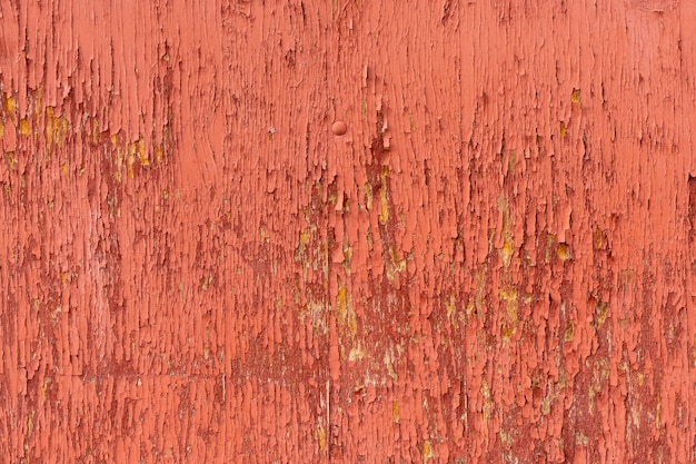 Surface en bois vieilli avec peinture écaillée
