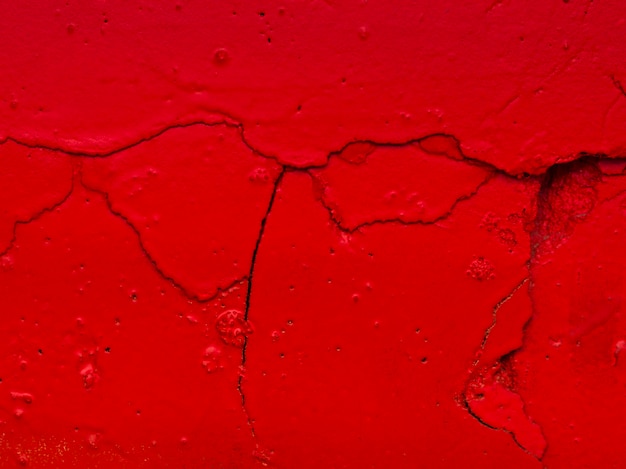 Surface de craquelins de peinture rouge