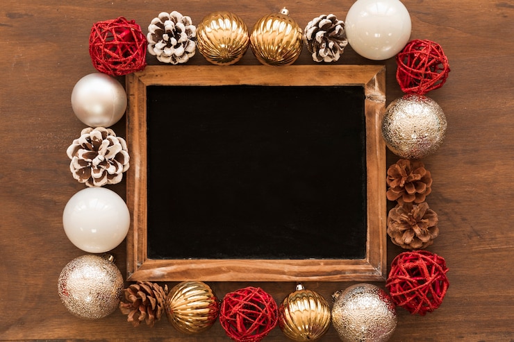 Photo gratuit tableau noir avec des boules lumineuses sur la table