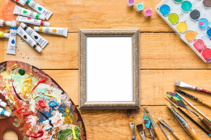 Photo gratuit tableau de la vue de dessus entouré d&#39;éléments de peinture