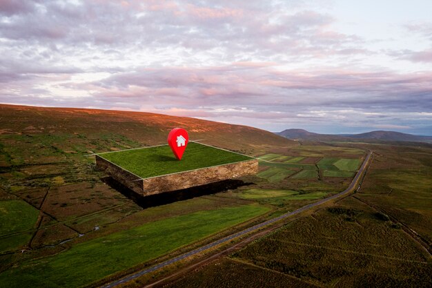 Terrain avec paysage naturel et broche de localisation