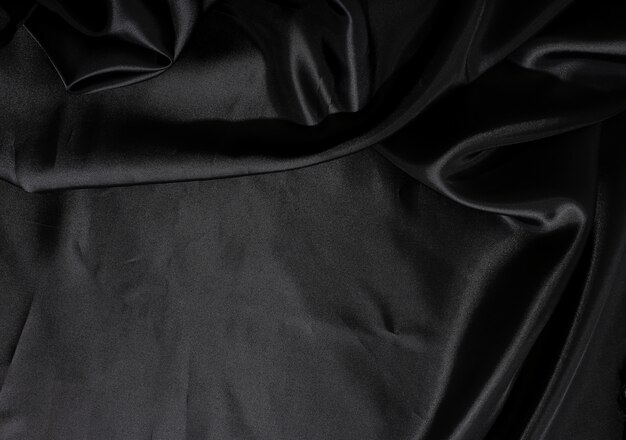 Texture de fond de tissu en soie noire