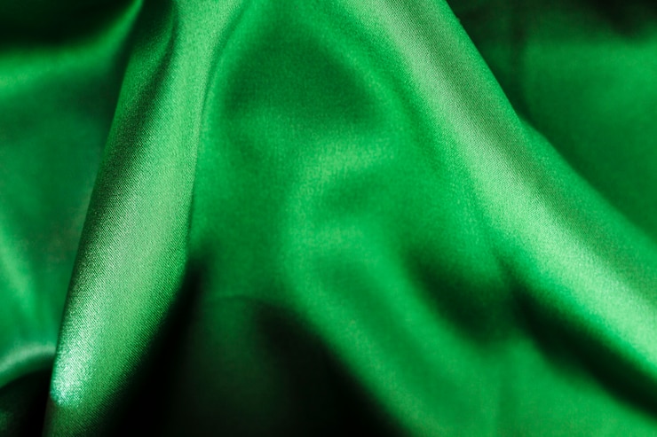 Photo gratuit texture matérielle de tissu vert avec espace copie
