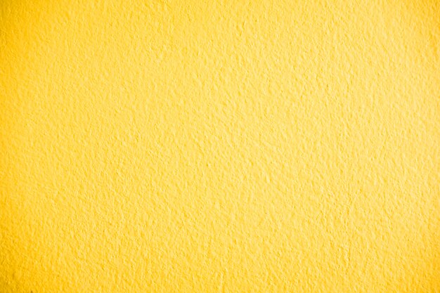 Texture de mur en béton jaune