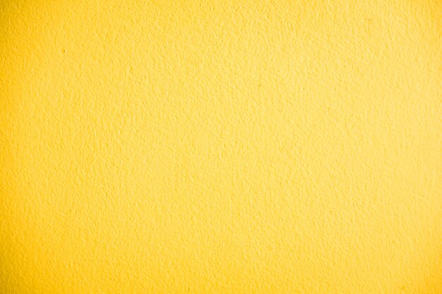 Texture de mur en béton jaune