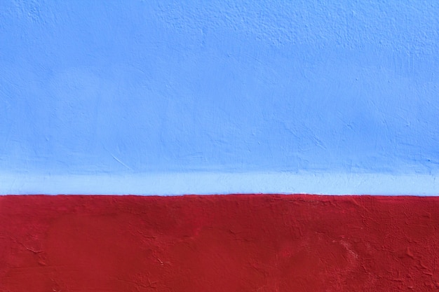 Texture de mur bleu et rouge