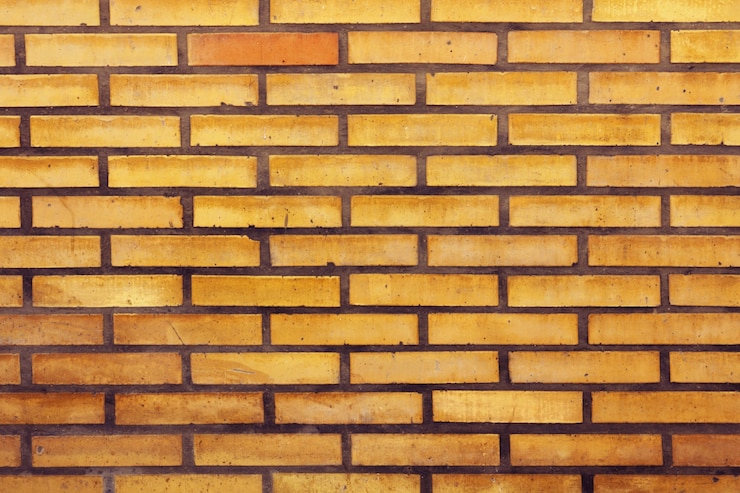 Photo gratuit texture de mur en briques d&#39;orange