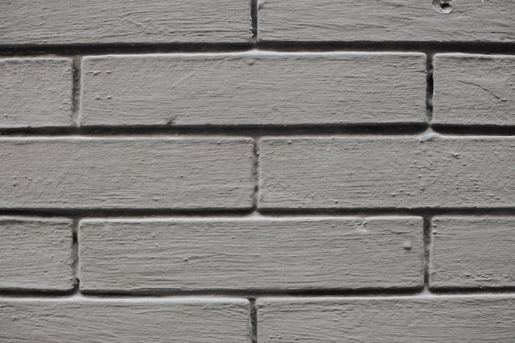 Photo gratuit texture de mur en briques peintes