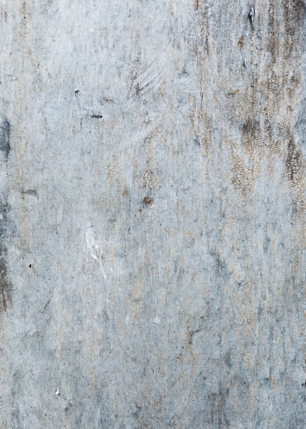 Texture de mur peint gris avec des fissures