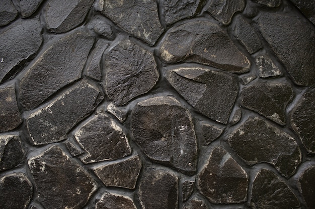 Texture de mur en pierre noire. Bali. Indonésie