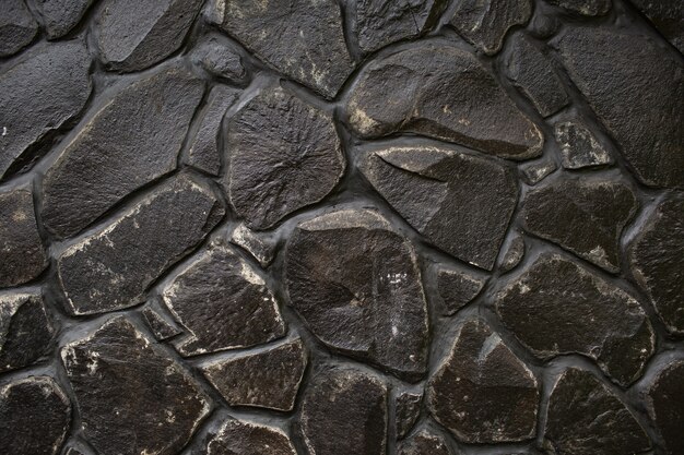 Texture de mur en pierre noire. Bali. Indonésie