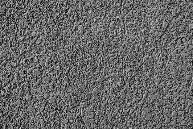 Texture de mur en plâtre de ciment gris brut
