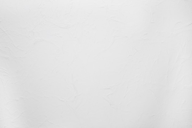 Texture rugueuse du mur de ciment plâtré blanc