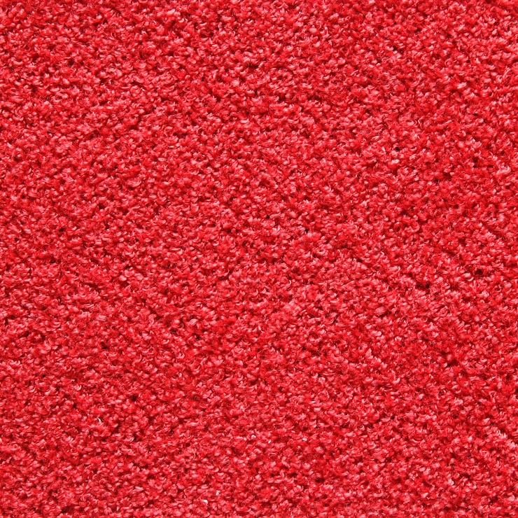 Photo gratuit texture de tapis rouge