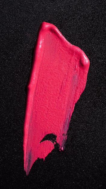Texture de teinte de brillant à lèvres rose mise à plat