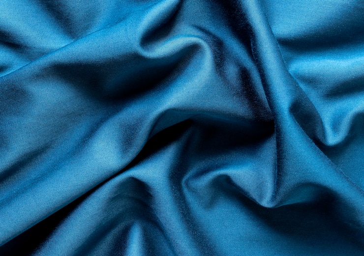 Photo gratuit texture de tissu plat
