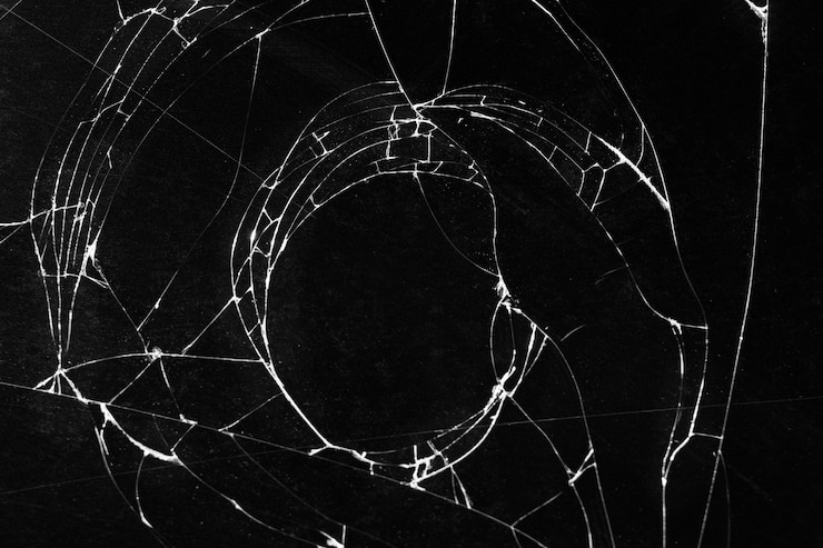 Photo gratuit texture de verre brisé avec forme de trou