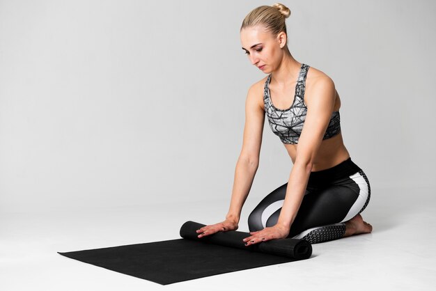 Tir complet femme pliant tapis de yoga