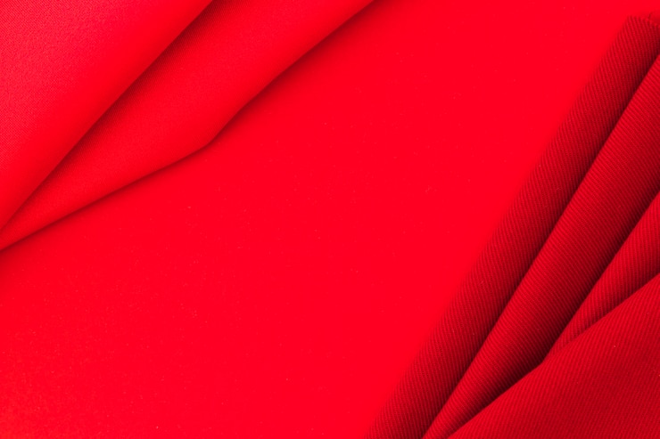 Photo gratuit tissu rouge sur fond de texture