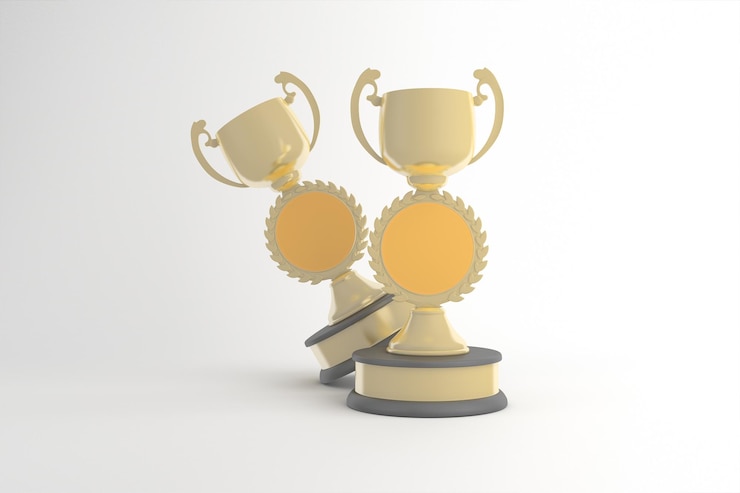 Photo gratuit trois trophées en or sur un fond blanc
