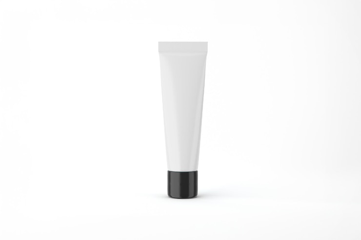 Photo gratuit tube de crème cosmétique blanche avec capuchon noir