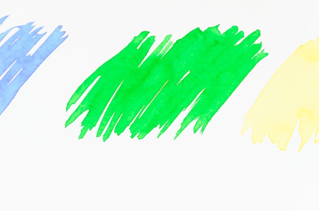 Vert; Coup de pinceau bleu et jaune sur fond blanc