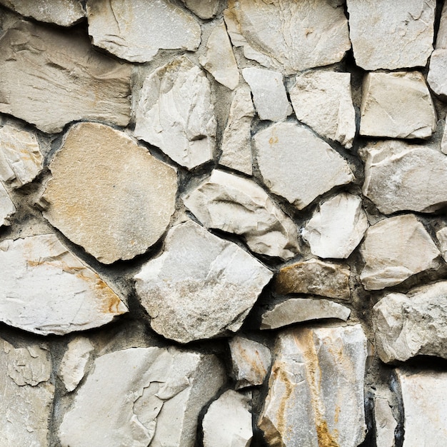Vieux fond de texture de mur en pierre gros rochers
