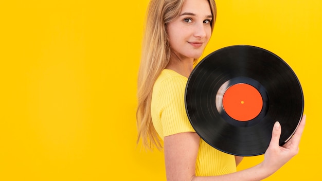 Vue côté, femme, tenue, vinyle