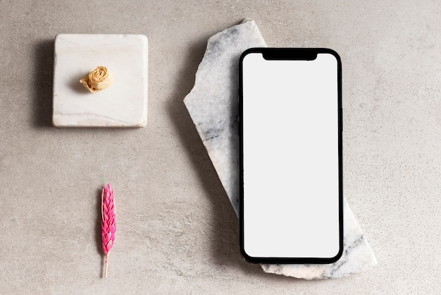 Vue de dessus arrangement smartphone et rochers