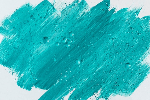 Photo gratuite vue de dessus des coups de pinceau de peinture bleue sur la surface