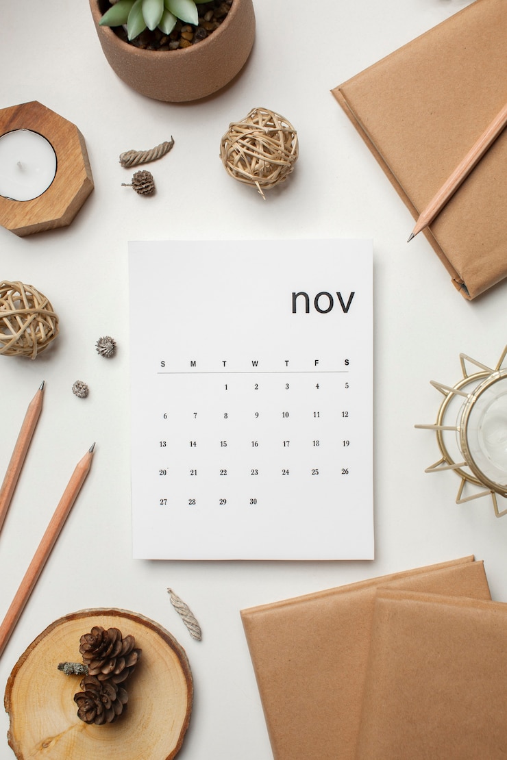 Photo gratuit vue de dessus du calendrier et des livres de novembre