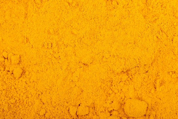 Vue de dessus du fond et de la texture de poudre de curcuma