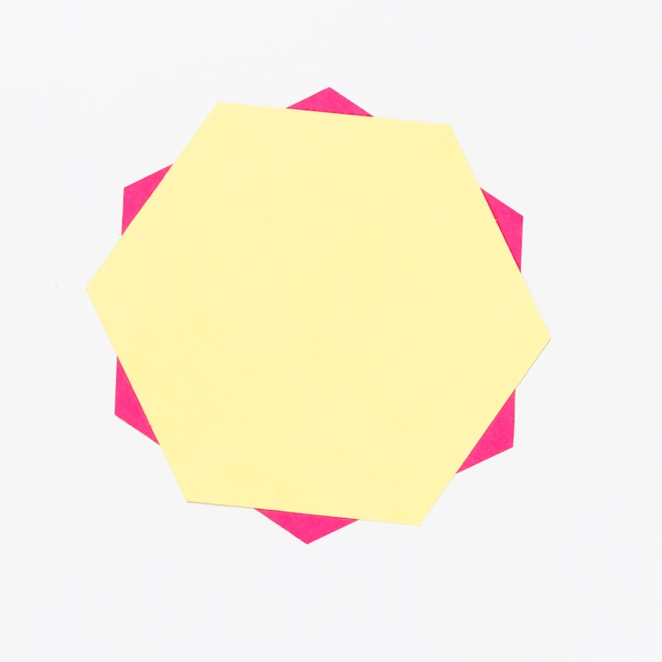 Photo gratuit vue de dessus hexagone de papier coloré