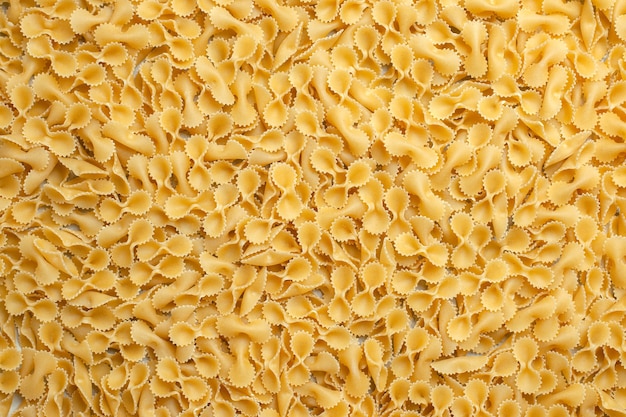 Vue de dessus petite photo de couleur de repas de pâte de pâtes crues