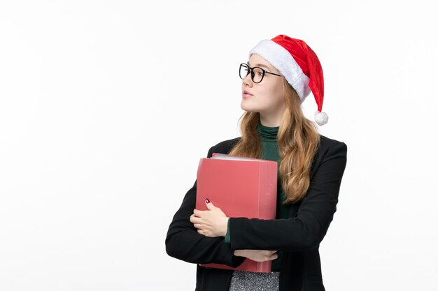 Vue de face jeune étudiante avec des fichiers livre école collège