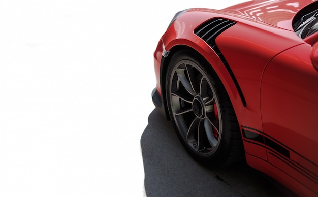 Photo gratuite vue latérale avant de voiture de sport rouge, roue noire avec couleur argent métallique.
