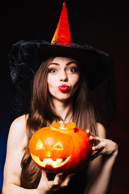 Witch girl with pumpkin