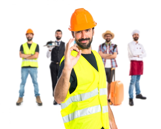 Workman making Ok sign over white background