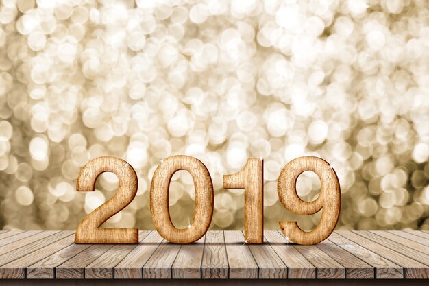 Photo 2019 bonne année bois sur table en bois avec mur de bokeh doré étincelant