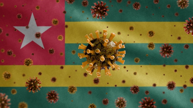 Photo 3d, coronavirus de la grippe flottant au-dessus du drapeau togolais, un agent pathogène qui attaque les voies respiratoires. modèle du togo en agitant avec la pandémie du concept de virus covid19.