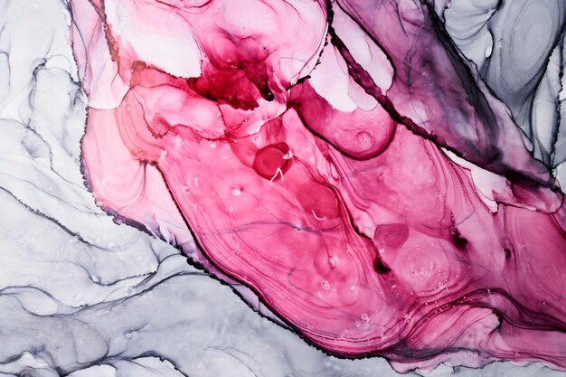 Abstrait aquarelle gris rose. Taches de peinture et taches ondulées dans l'eau, papier peint d'art liquide fluide de luxe