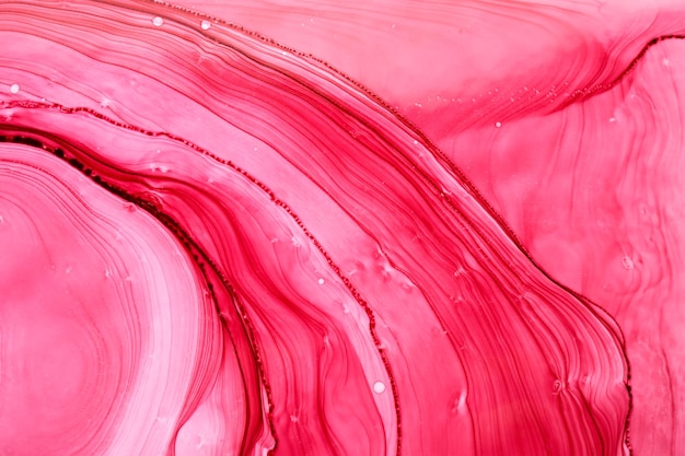 Abstrait aquarelle rose. Taches de peinture et taches ondulées dans l'eau, papier peint d'art liquide fluide de luxe