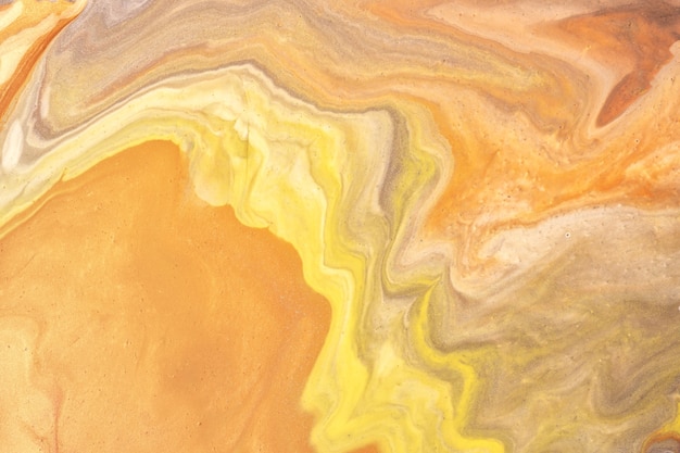 Abstrait art fluide couleurs jaune clair et orange. Marbre liquide. Peinture acrylique avec dégradé doré