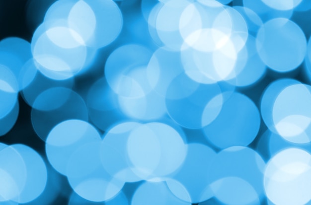 Abstrait élégant bleu festif Noël avec beaucoup de lumières de bokeh. Image artistique défocalisée