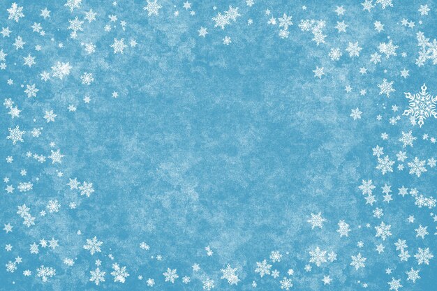 Abstrait d'hiver - flocons de neige sur fond bleu.