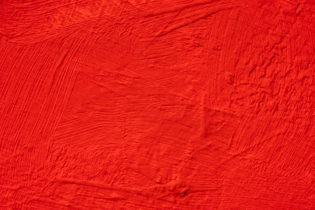 Abstrait de mur de béton rouge. Brosse texture peinte sur le mur.