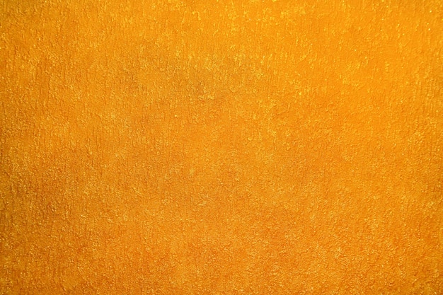 Abstrait de mur d'or de paillettes jaune vif de texture