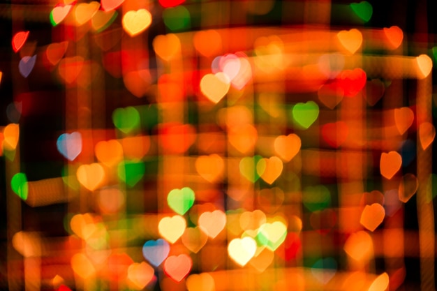 Photo abstrait romantique avec bokeh multicolore en forme de coeurs