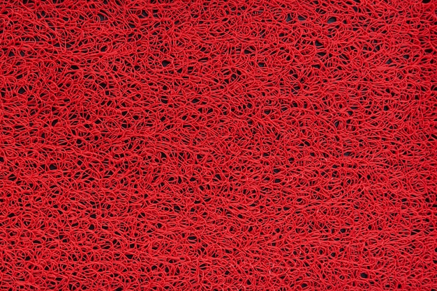 Abstrait rouge avec une texture rugueuse. Fond écarlate.